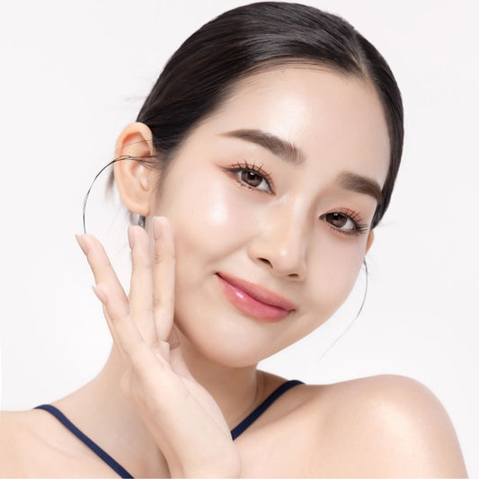 Woman with Pinkalulu Glow Serum against a white background