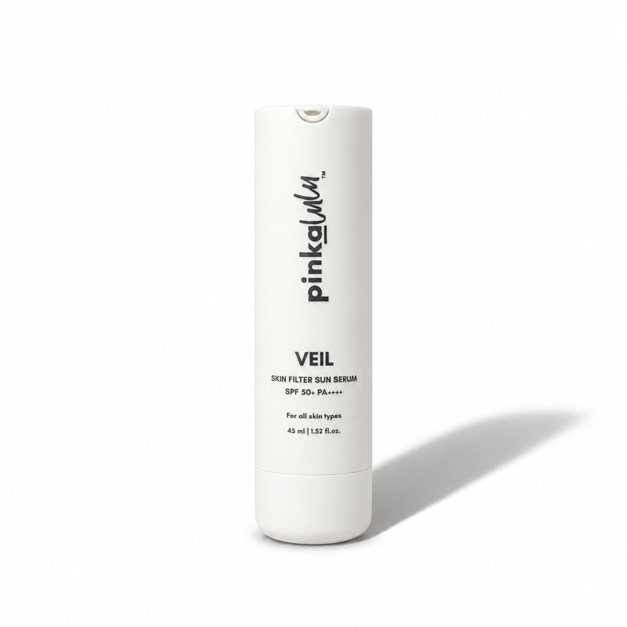 A white cylindrical bottle of pinkalulu VEIL Skin Filter Sun Serum with black text, photographed on a clean white background with a soft shadow to the right.