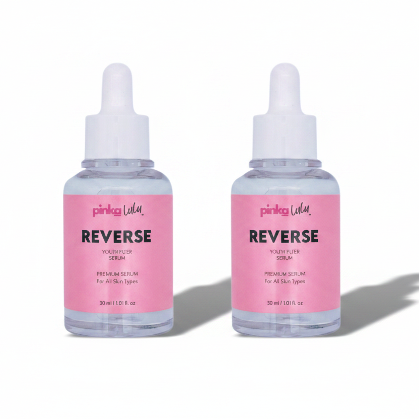 Two bottles of Pinkalulu Reverse skincare serums on a white background