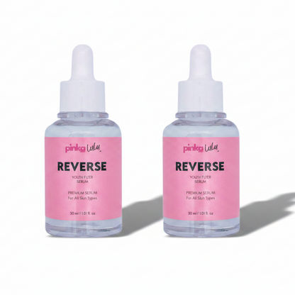 Two bottles of Pinkalulu Reverse skincare serums on a white background