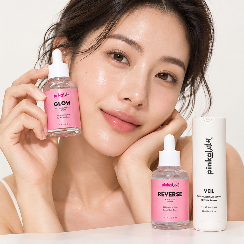 A lady on to a Pinkalulu Glow Serum with Reverse Serum and Veil Sun Serum on table.
