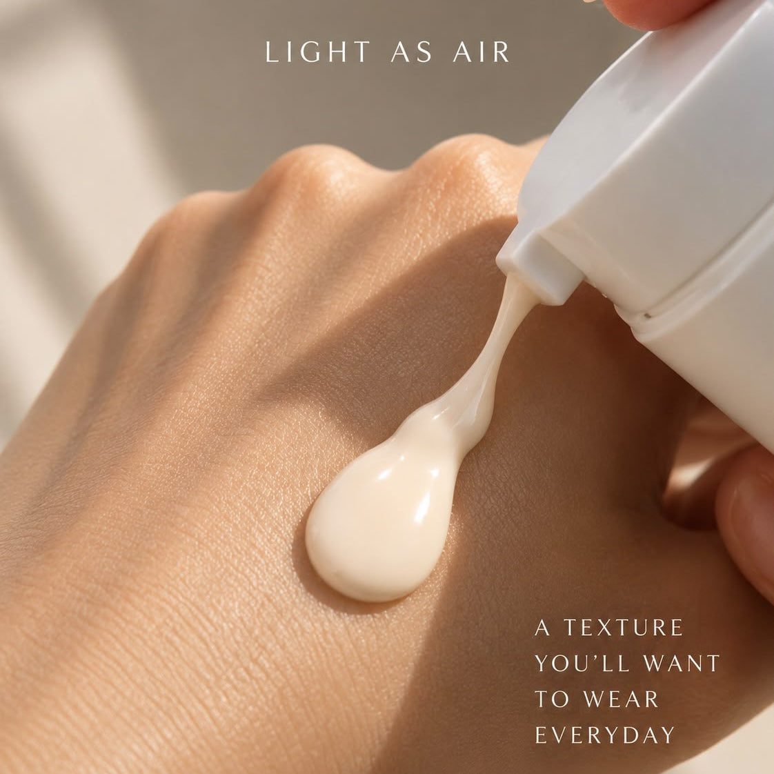 A close-up of a hand receiving a glossy, cream-colored cosmetic product from a white pump bottle. The text 'LIGHT AS AIR' and 'A TEXTURE YOU'LL WANT TO WEAR EVERYDAY' are overlaid on the image.