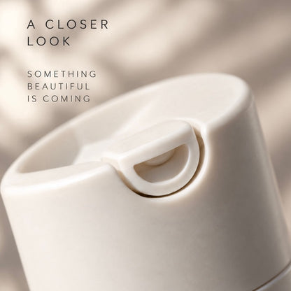 A close-up of a matte off-white plastic product, likely a lid or container.