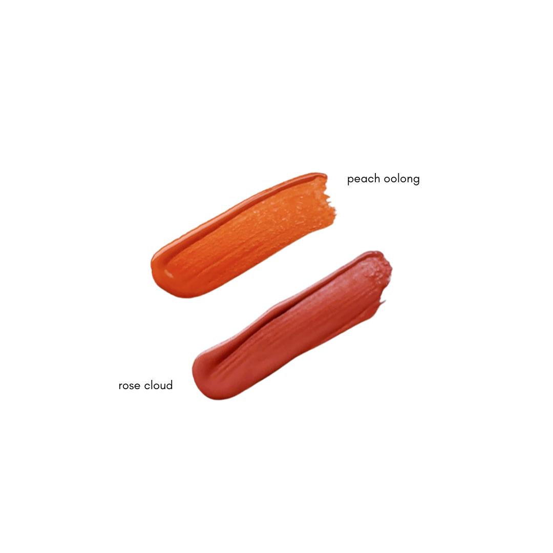 Two swatches of Pinkalulu peach oolong and rose cloud Blush Tint on a white background