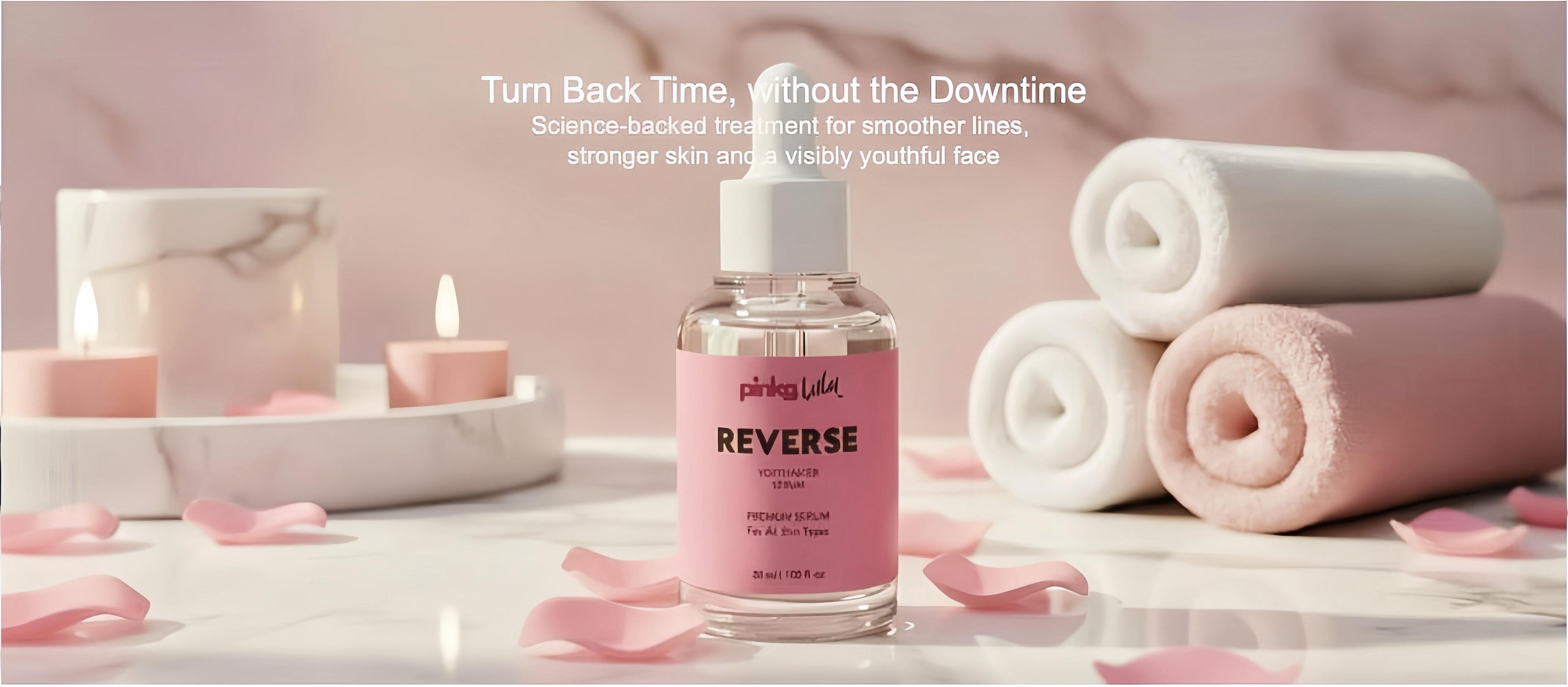 Skincare product with pink packaging on a white surface with pink towels and candles.