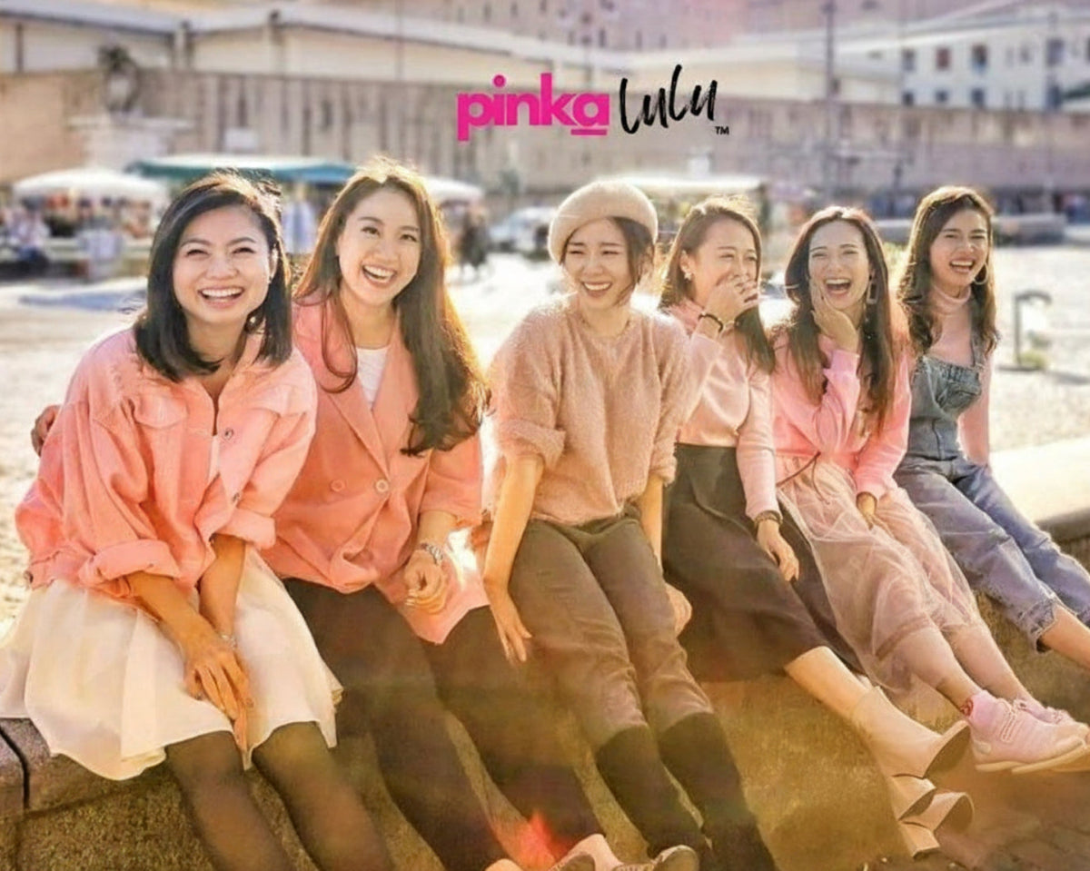 Group of women sitting together with 'pinkalulu' branding