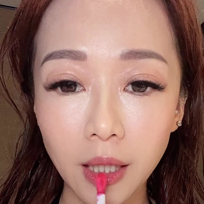 a lady model applying Pinkalulu tint lip oil